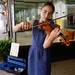 12-year-old Katie Sesi, of Ann Arbor, performs in front of Ayla & Co as she raises money to donate to C.S. Mott Children's Hospital during the Guild?s Ann Arbor Summer Art Fair on Thursday, July 18, 2013. Sesi, who has been busking and collecting cans for charity since she was six, has raised over $20,000 and is aiming to raise $10,000 this year. Melanie Maxwell | AnnArbor.com